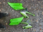 2006 Kawasaki KX80 Dirt Bike Plastics Read. Fixed Price $40.00.