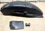 Suzuki GT380 Sebring Rear Fender Front Inner Plastic # 63112-33004. Fixed Price $20.00.