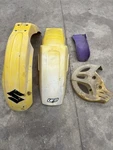 1992 RM125 Rear & Front Fender Cover Mud Flap Mount Bracket Disc. Fixed Price $50.00.