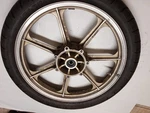 Kawasaki KZ750N Spectre Front Wheel With New Tire Fits 1981-1983. Fixed Price $160.00.
