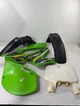 1999 Kawasaki KX125 Oem Full Complete Plastic Kit Green/black/white #261. Fixed Price $75.99.