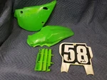 1991 - 97 Kawasaki Plastics Fender Side Rad Plate Cover Oem Green 93. Fixed Price $75.00.