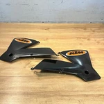 New Ktm Oem Black Radiator Shrouds / 03-04 Sx Exc Mxc 50308150000 50308151000. Fixed Price $45.00.