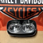 Harley Davidson 10-13 Road Glide Oem Headlight Assembly 67775-10 Fltr. Fixed Price $145.00.